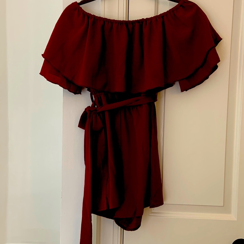 Wine colored romper with belt. Size Small.
